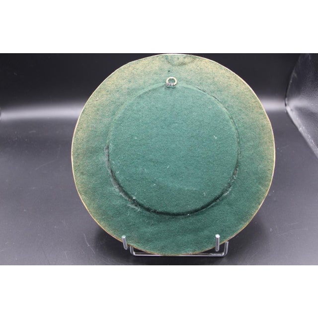 Round ceramic mirror, "Pique" model by Mithé Espelt in very good condition, unusual color This piece is attributed to the...