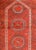 A charming early 20th century Afghan Ersari Prayer Rug with three octagonal medallions on a crimson background with...