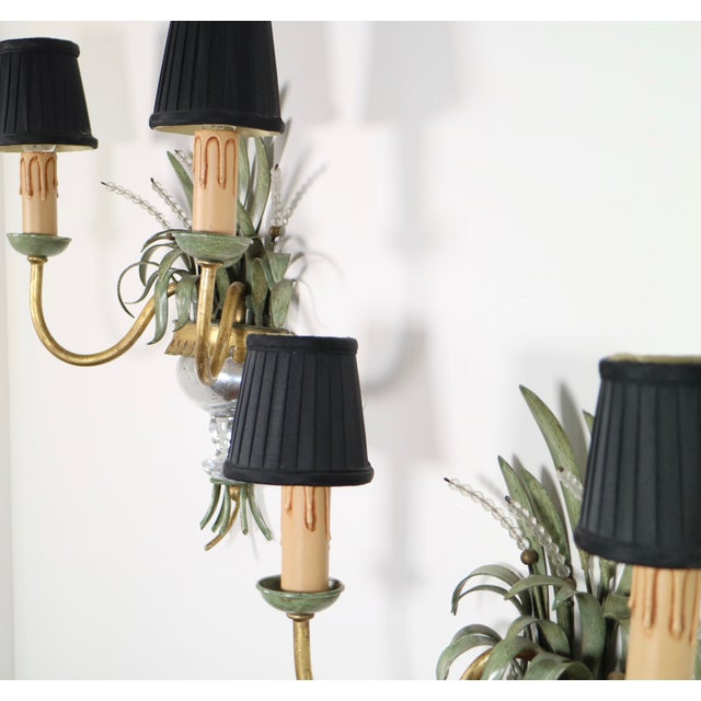 An incredible pair of wall lights in the Bagues style by Banci Fireze, the fern form in olive green with faceted crystals...