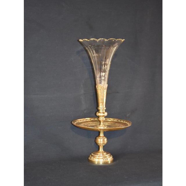 19th century gorgeous epergne from France with a gorgeous hand cast brass base and a cut glass trumpet form faceted flute.