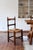 A set of six rustic dining chairs in solid oak, made in France in the 1940s in the manner of Charles Dudouyt. The back is...