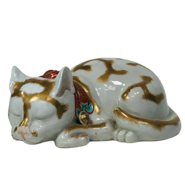 Early 20th century Japanese Kutani porcelain figure of a sleeping cat. Nice proportions and detail in the molding...