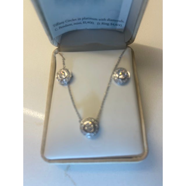 3 pcs famous name pendant set. 16" pendant, stud earings done in sterling/cz