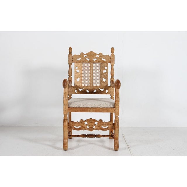 Danish handcrafted armchair of solid oak, made in the 1940´s by a Danish cabinetmaker. The sculptural chair is richly...