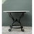 This dining table pairs a smooth stone top with a sculptural wrought iron base built for both stability and visual drama....