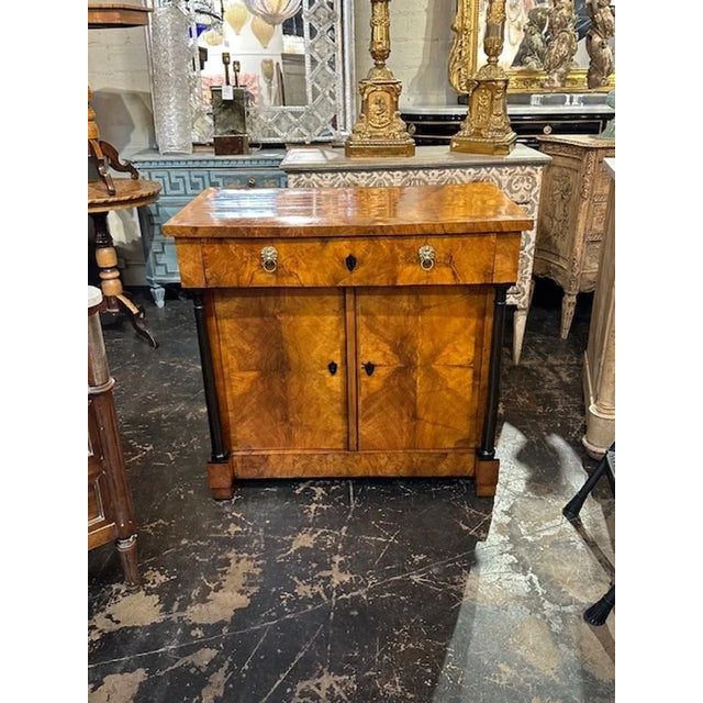 Gorgeous 19th century German Walnut Biedermeier side cabinet. Beautiful, polished wood with ebonized details and storage...