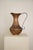 Large Vintage Copper Pitcher with Curled Handle Shows signs of patina
