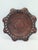A decorative plate handmade from natural leather, richly embossed with geometric ornaments and folk motifs characteristic...
