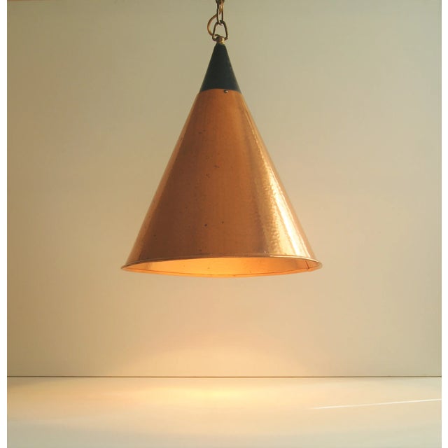 Rare cone - shaped copper pendant ceiling lamp. Denmark 1960s. Hammered structured copper with chain and copper ceiling...