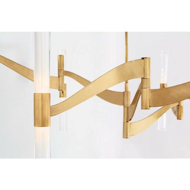 Elegant Visual Comfort Brenta Grande chandelier is made of hand rubbed antique brass with clear glass cylinders. This...