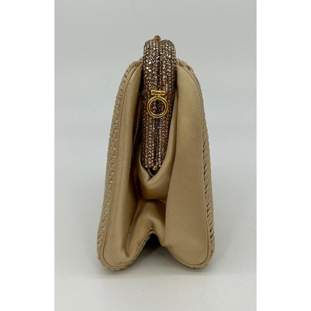 Vintage Judith Leiber Beige Pleated Silk Swarovski Crystal Top Clutch c1980s in good condition. Beige pleated silk...