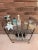Vintage Mid Century Metal Bar Cart. Stylish kidney shaped two tiered design complete with smooth rolling wheels and acorn...