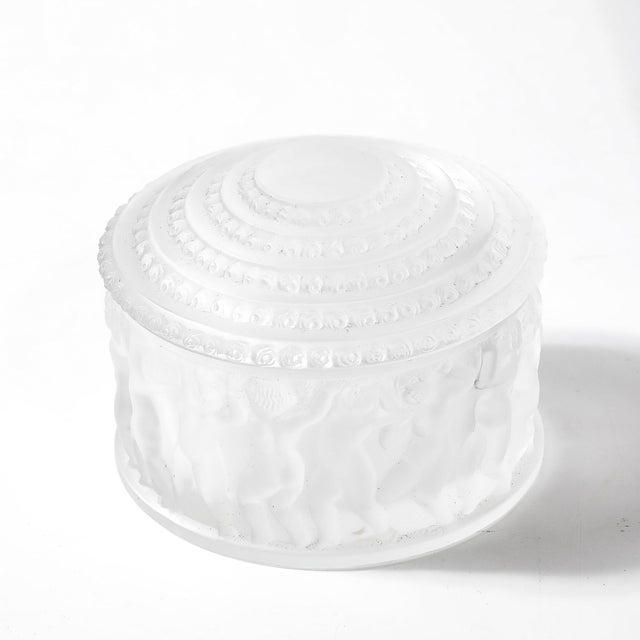 The Mid-Century Modernist Crystal "Les Enfants" Lidded Powder Box, signed Lalique, France, circa 1960, is a charming and...