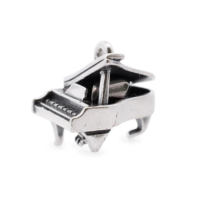 One JAMES AVERY made matte finished silver, slider pendant. Stamped "STER". The "JAMES AVERY" trademark (or hallmark) can...