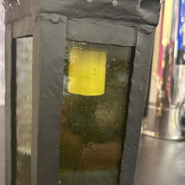 Very attractive antique lantern repurposed and electrified. The body is made of metal that has been painted black and the...