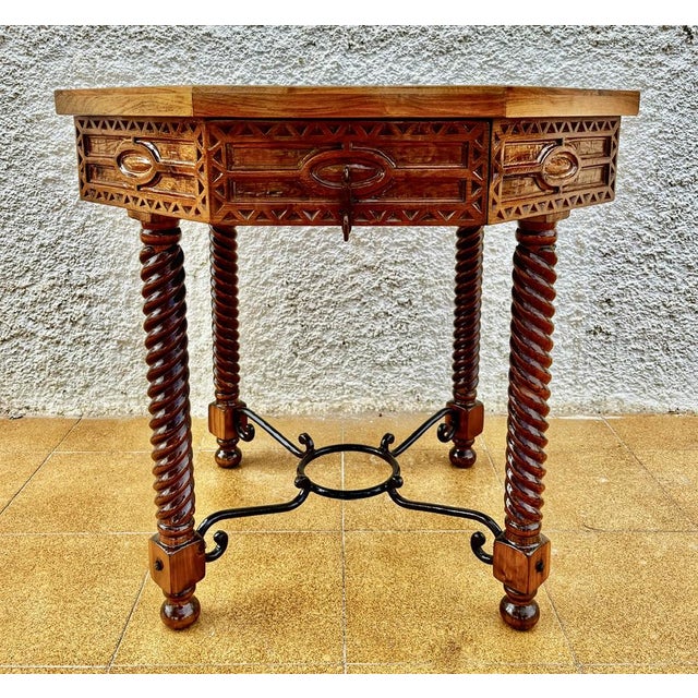 Antique octagonal table on twisted legs. Made in France at the beginning of the 20th century. It is made of solid oak...