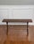 Wrought iron sculptural scroll base bench or coffee table with a faux leathered trompe-l'oeil finish metal top, 1960s....