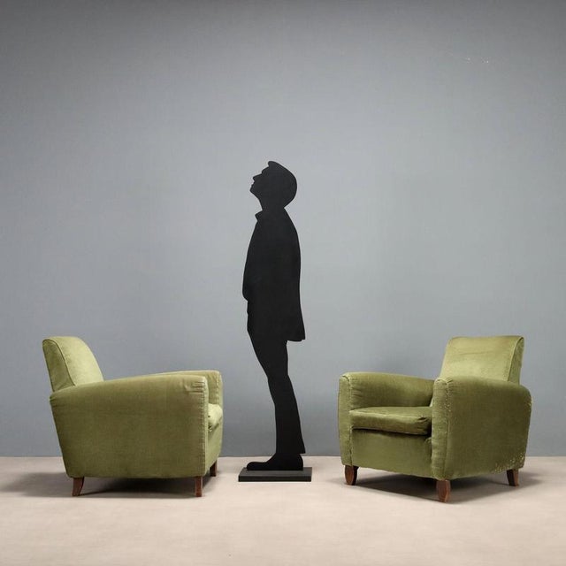 Pair of armchairs with sprung padding, velvet upholstery, wooden legs. This piece is attributed to the mentioned...