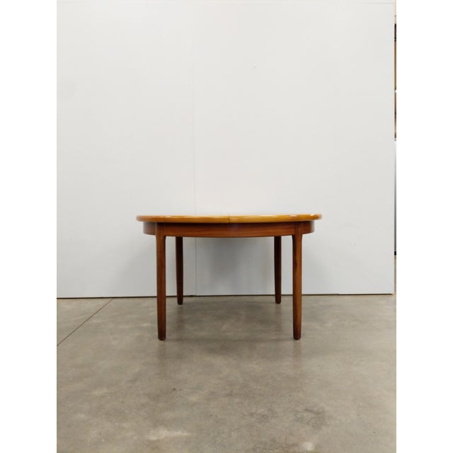 Authentic vintage mid century modern teak extendable dining table with 1 built-in leaf. This piece is in excellent...