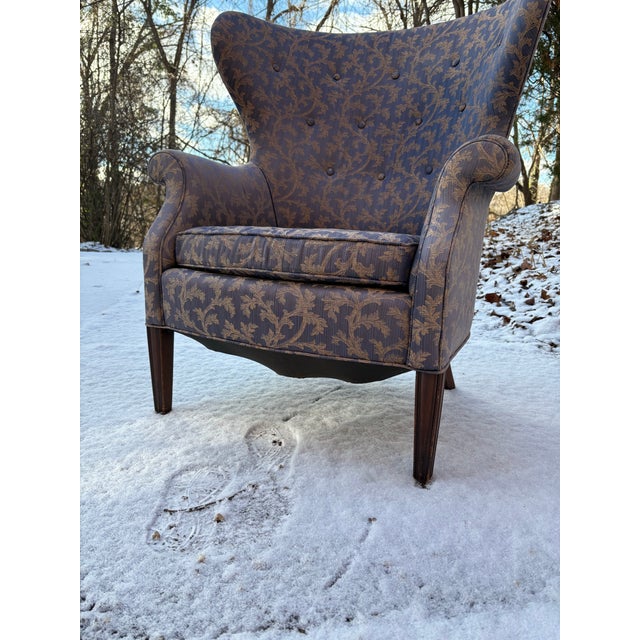 1950s/60s era butterfly wingback chair. Chair has been more recently recovered in a periwinkle silk with a muted gold vine...