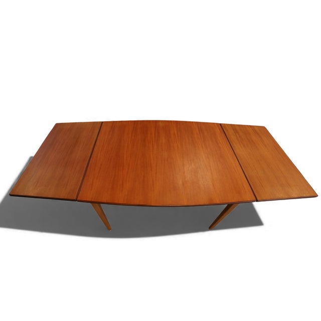 Neat and elegant dining table with teak table tops and oak legs. The combination of teak and oak was very common in the...