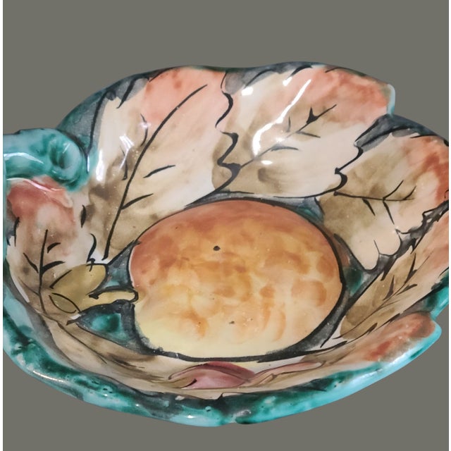 Discover the charm of vintage Italian craftsmanship with this Majolica pottery serving dish. Featuring a delightful...