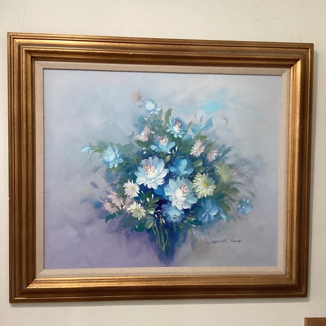 The product is an original still life painting on canvas by artist Robert Cox, featuring a richly arranged bouquet of...