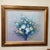 The product is an original still life painting on canvas by artist Robert Cox, featuring a richly arranged bouquet of...