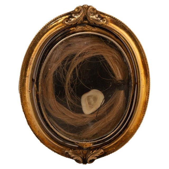 A fine antique 10k yellow gold carved shell swivel cameo mourning brooch/locket, with hair & a tooth under crystal to the...
