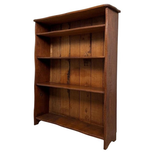 A handsome and well-crafted 20th-century open bookcase, beautifully constructed in oak and distinguished by its generous...