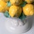 This striking decorative piece, crafted from glazed ceramic, features a pyramidal cluster of lemons, a traditional motif...