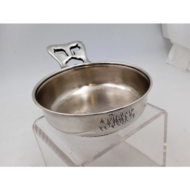 Tiffany & Co. aesthetic sterling silver porringer dish, circa 1880s. Measurements: 7 1/4" across (with handle); bowl is 5"...