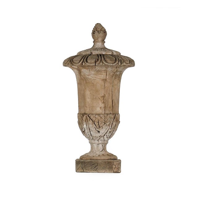 The Wooden Urn (Medium) from Zentique is a poplar wood urn with a classical turned form. Measures 21"H x 10" diameter....
