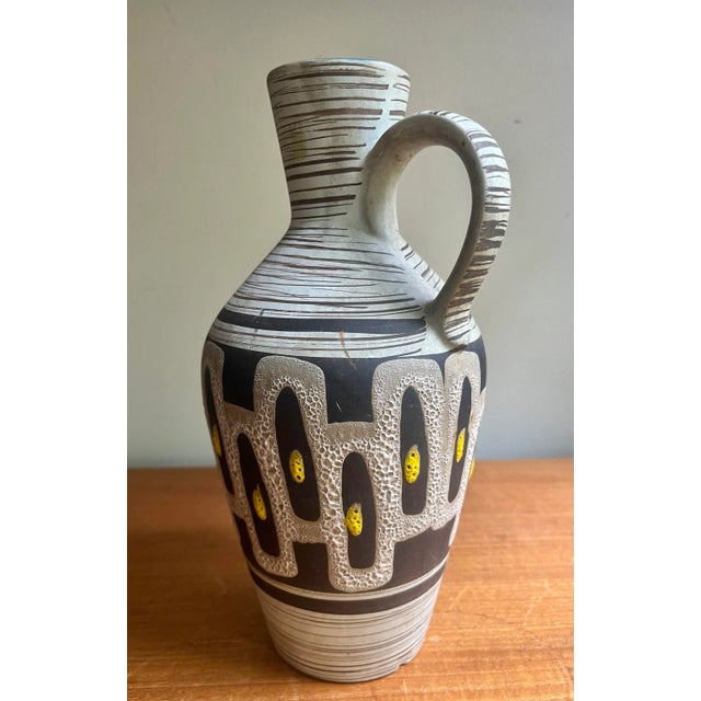 This lush West German ceramic has eye popping design and color. Wonderful accent for you mantel or office desk that will...