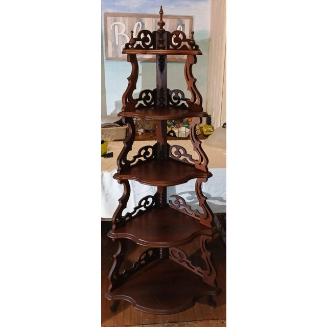 Gorgeous ornate Victorian Corner Etagere with five shelves. Beautiful carvings, all finials intact. 4th shelf has one...