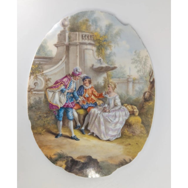 We are selling this well painted French porcelain plaque. This plaque features a Romantic courting scene with well dressed...