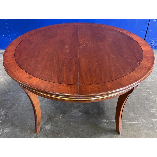 Medium Mahogany Finish on Medium Mahogany with Gold Gilded Details. 54″ Diameter (Closed) x 30″ H with 24″ Leaf. From the...