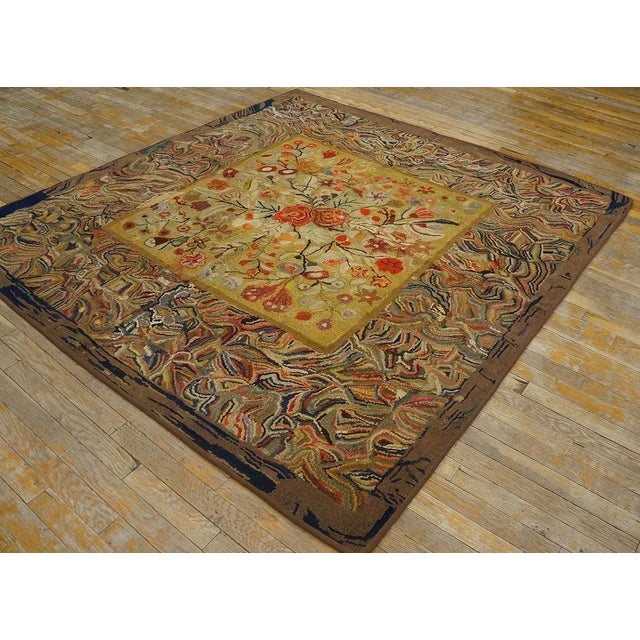 Antique American hooked rug. Size: 6' 5'' x 6' 5''.