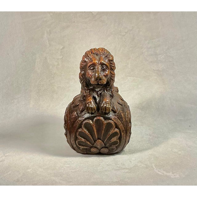 Crouching lion sitting atop a round ball, hand-carved oak wooden finial, decorative cap for a grand staircase newel post....