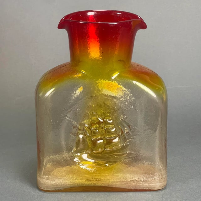 Beautiful Kanawha cast glass twin spout water decanter with an amazing orange to amber to yellow gradient. These are often...