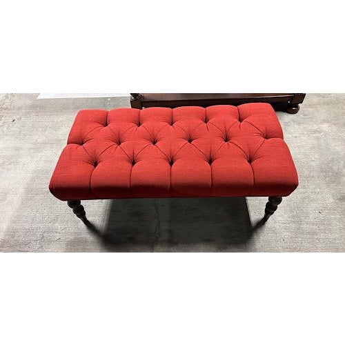 Elegant tufted bench/ottoman in a rich red woven fabric with classic diamond biscuit tufting throughout. Sits on dark...