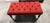 Elegant tufted bench/ottoman in a rich red woven fabric with classic diamond biscuit tufting throughout. Sits on dark...