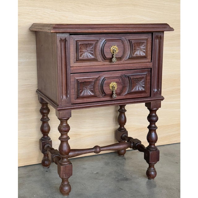 20th century pair of Spanish nightstands with two carved drawer and iron hardware. Beautiful tables that you can use like...