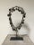A shaman necklace constructed of various brass and bronze bells suspended from a metal chain. Well-worn with beautiful...