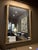 French giltwood mirror featuring a classic rectangular form with softly rounded corners, beaded inner molding, and a...