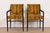 A gorgeous pair of mid-century Hollywood Regency armchairs or club chairs USA, Circa 1970s Ebonized bamboo form walnut...