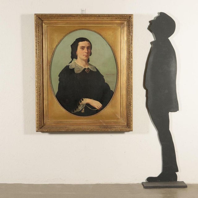 Oil on canvas. Signed on the right, halfway up the canvas. It is the portrait of a woman in mourning, a young widow, as...