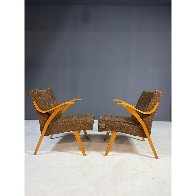 A comfortable pair of retro armchairs made by Jitona Soběslav in the 1970s in former Czechoslovakia. These chairs feature...