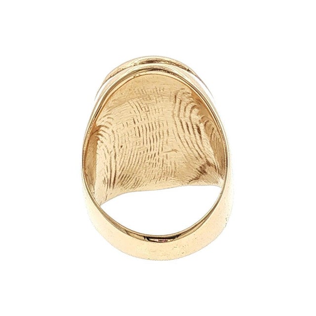 A striking piece from the late 20th century. This ring features a bold black onyx in a smooth cabochon cut. The stone is...