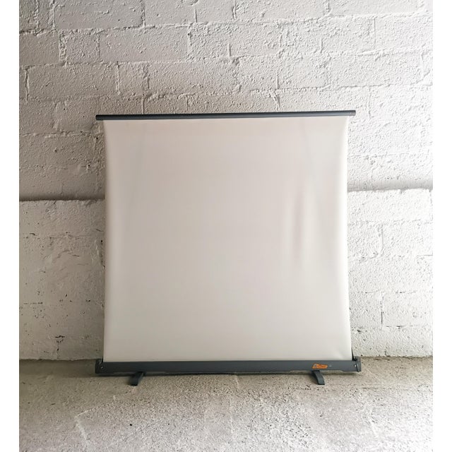 This foldable, white reflective projection screen from STEVO dates back to the 1950s and is in unused, original condition....